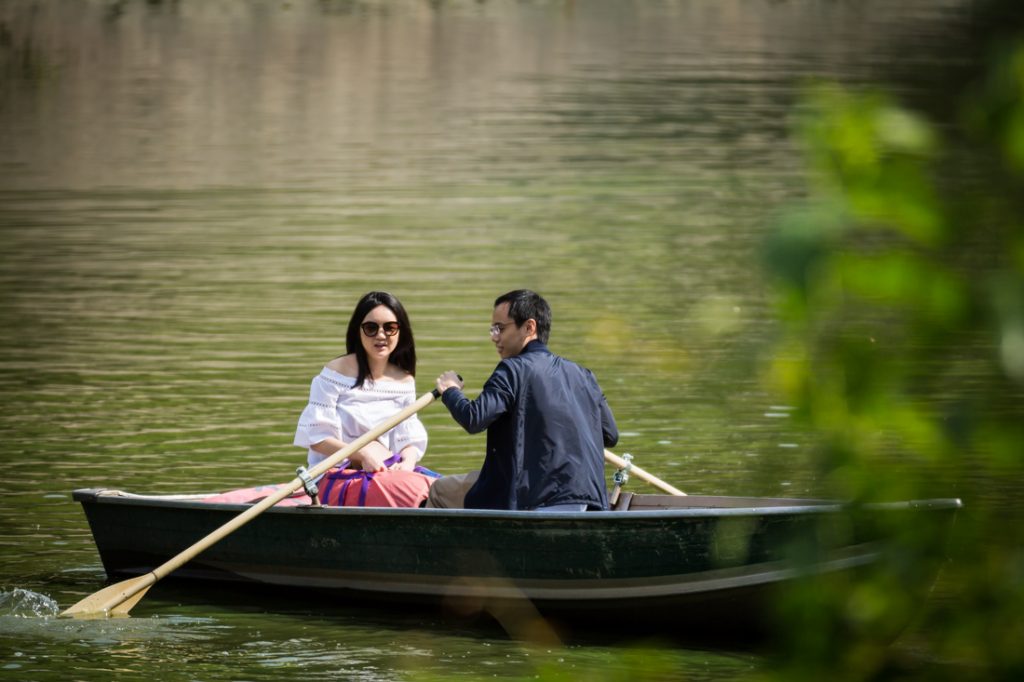 Couple rowing a boat for an article on a Central Park lake proposal