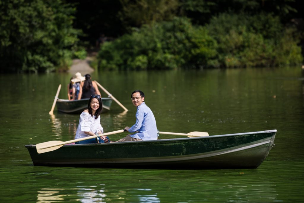 Couple rowing a boat for an article on a Central Park lake proposal