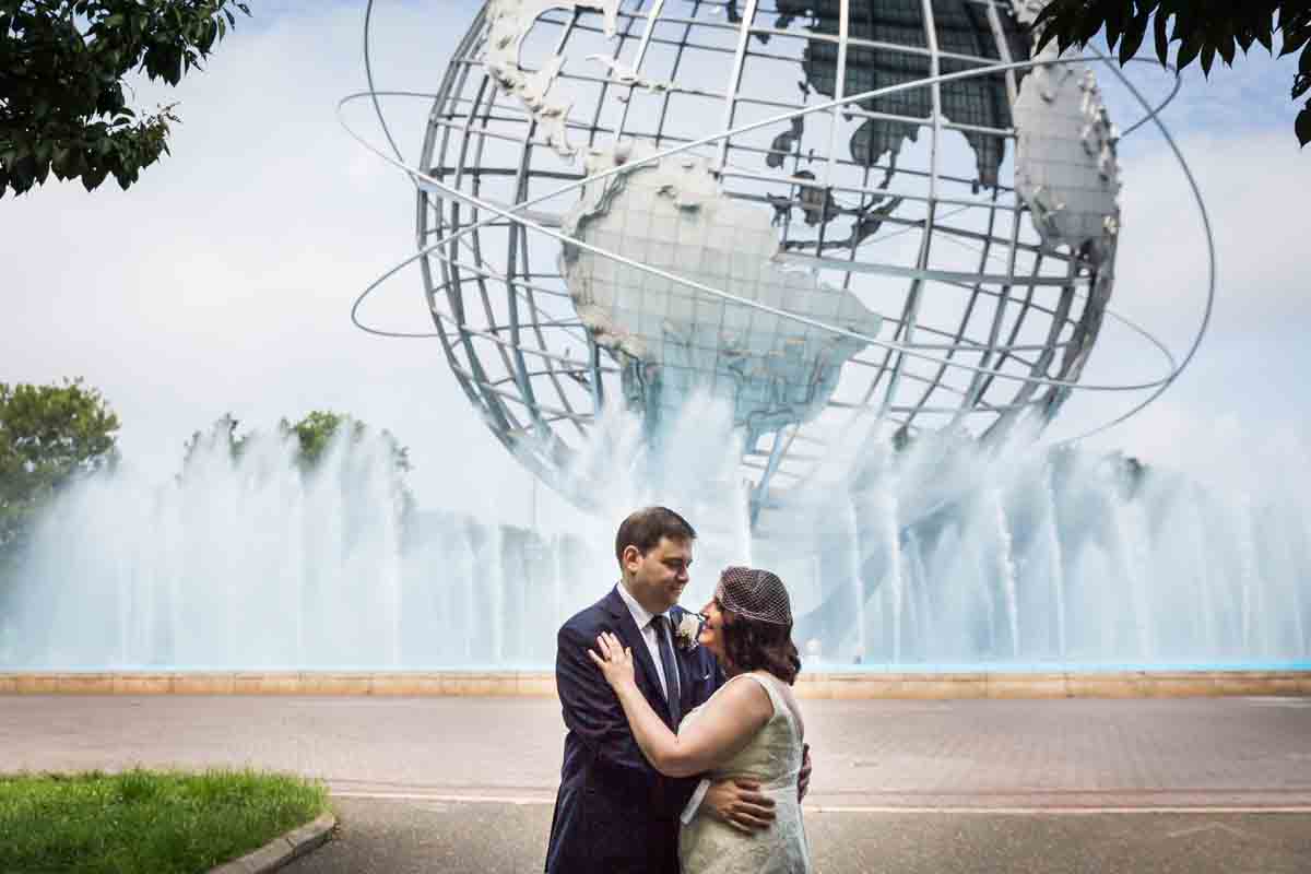 Bride and groom in front of the Unisphere for article on a Terrace on the Park wedding