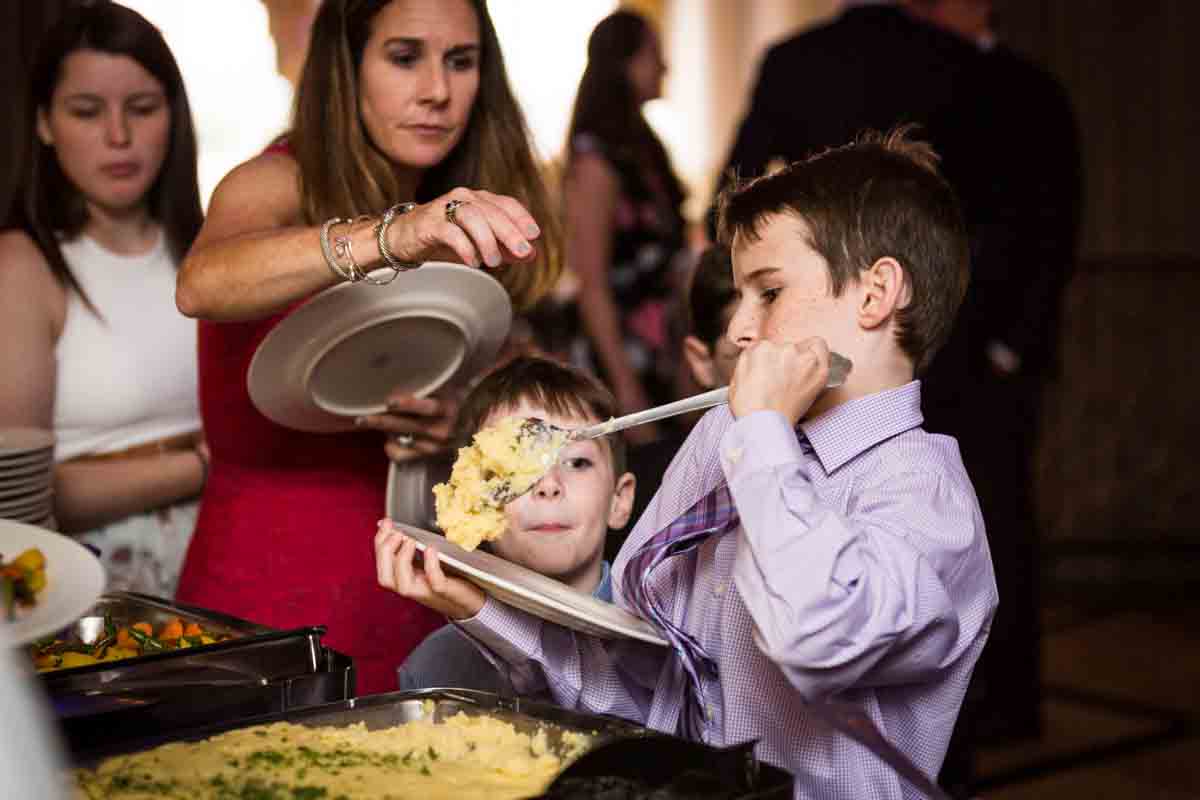 Little boy at buffet for article on a Terrace on the Park wedding