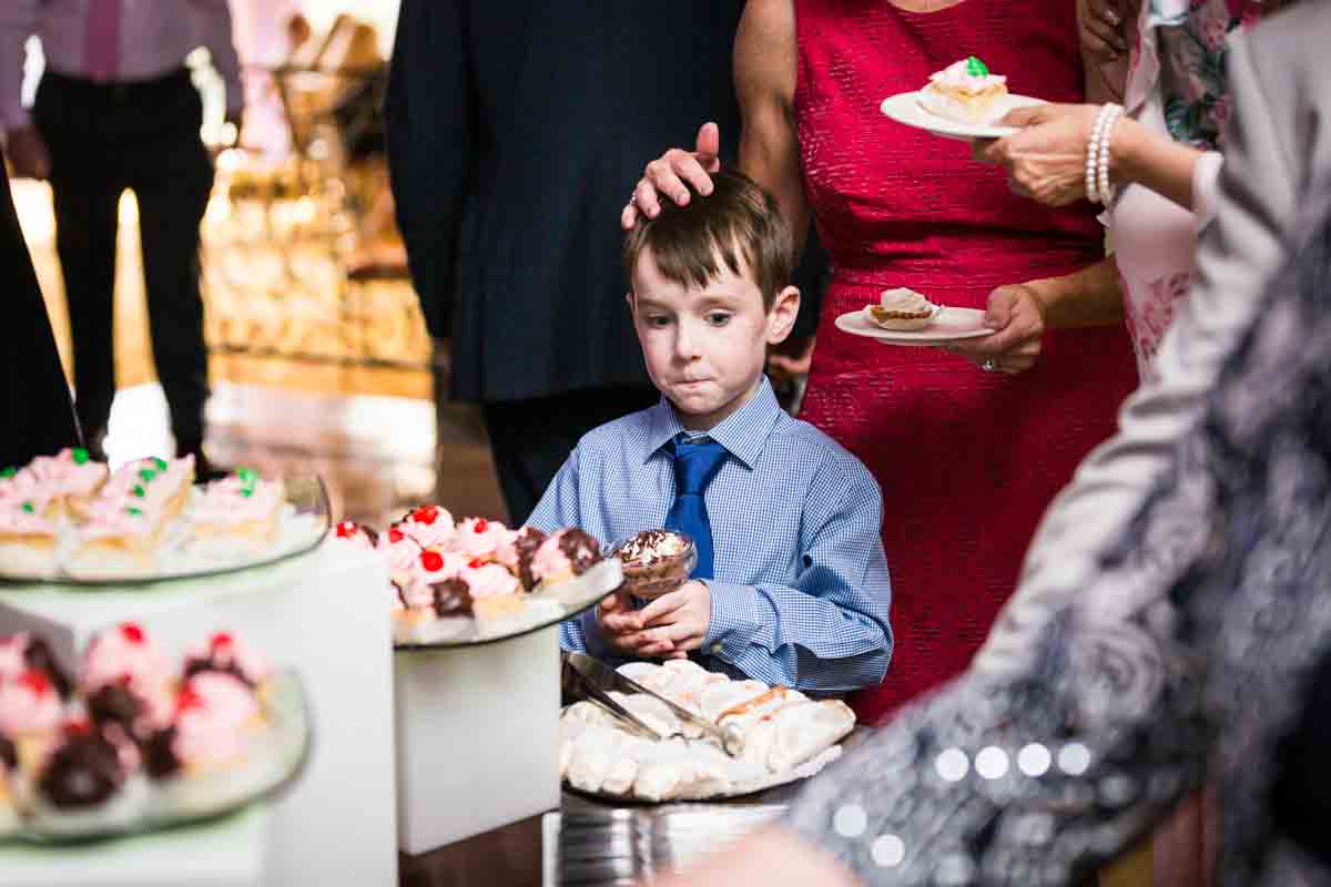 Little boy with desserts for article on a Terrace on the Park wedding