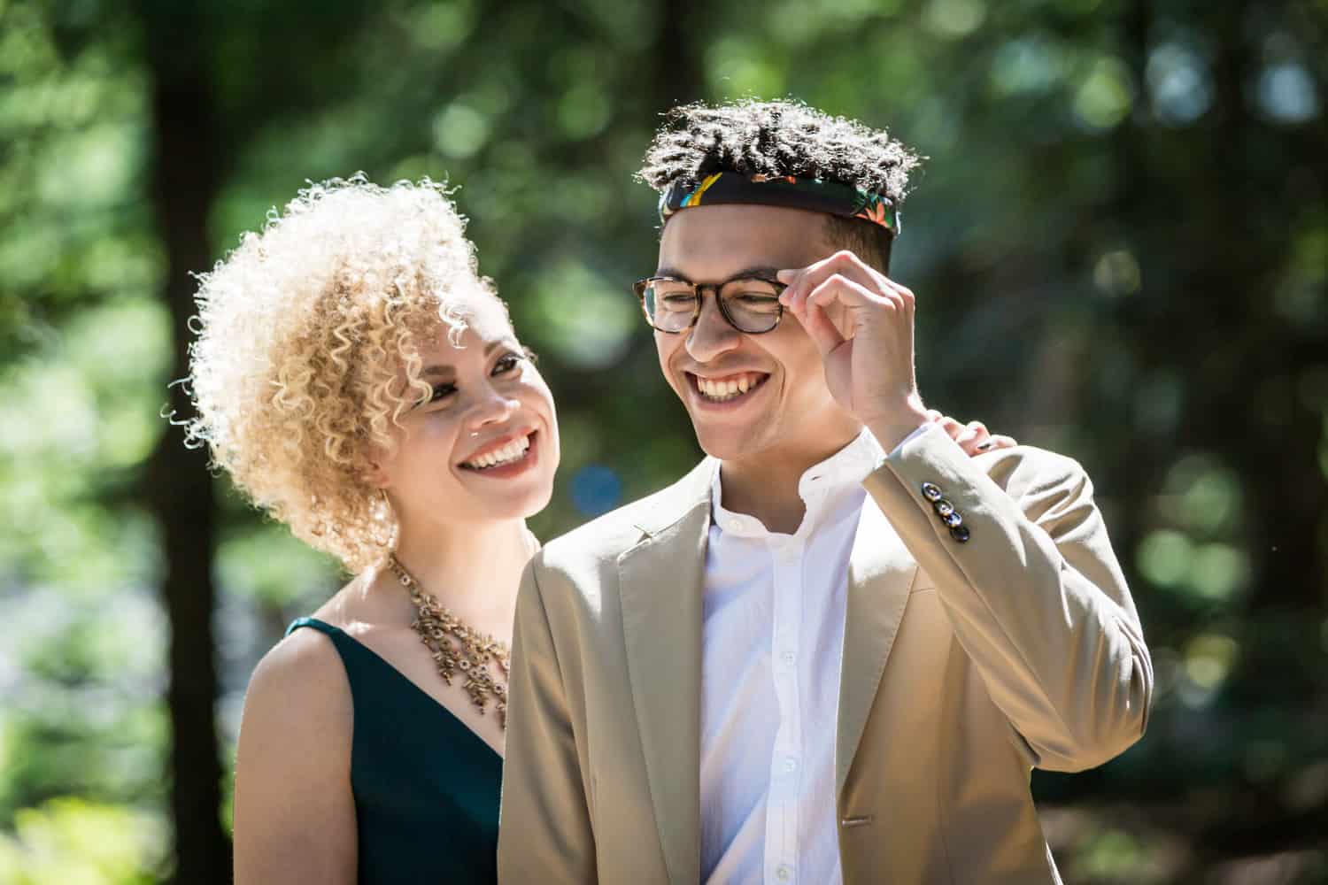 Mother and son touching sunglasses during a family reunion portrait
