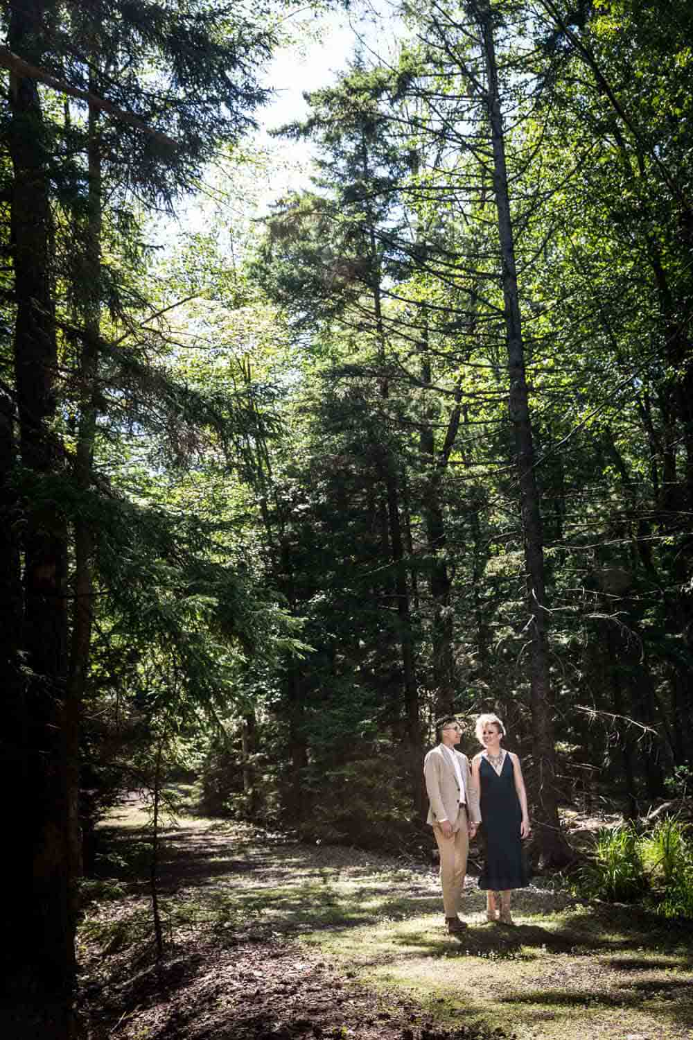 Mother and son walking in the woods during a family reunion portrait