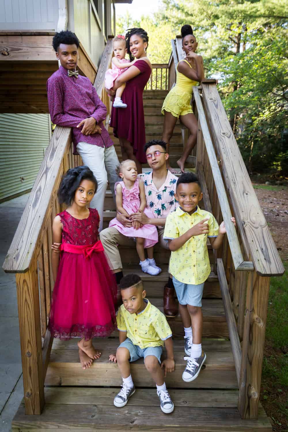 Kids posed on staircase during a family reunion portrait
