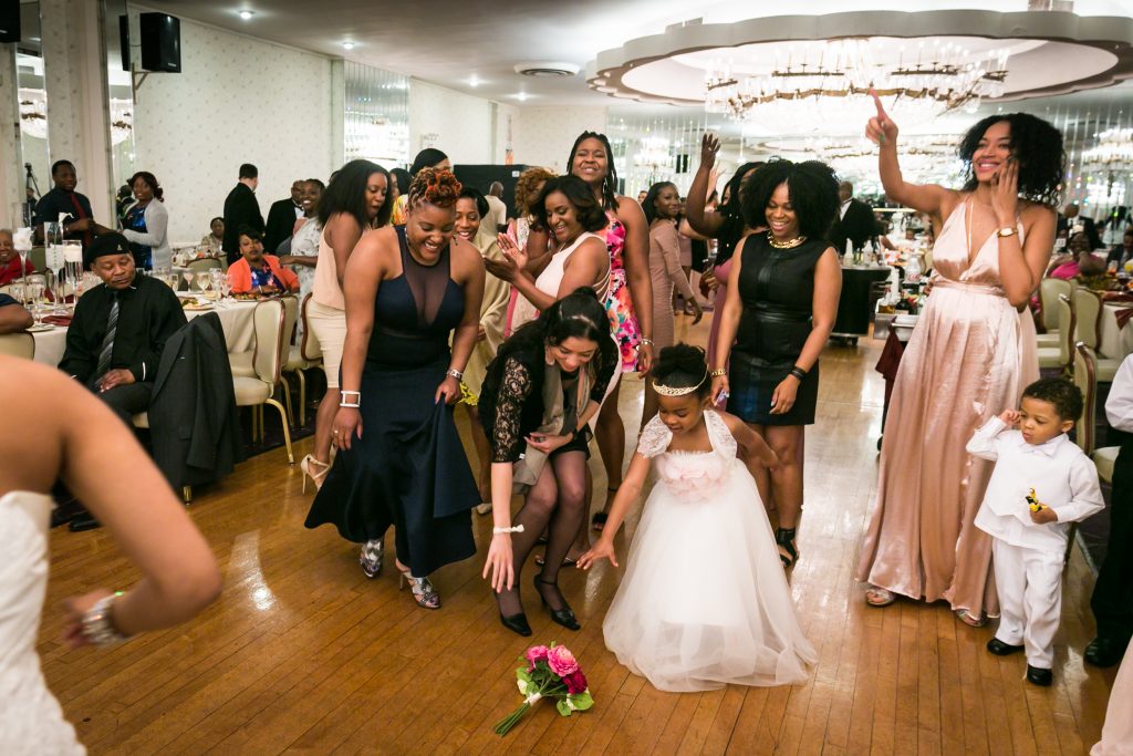 Little girl with bouquet for an article on bouquet and garter toss alternatives