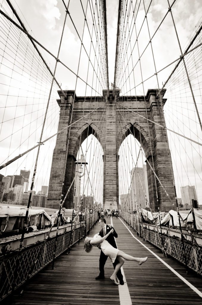 Couple on Brooklyn Bridge for an article on City Hall wedding portrait locations