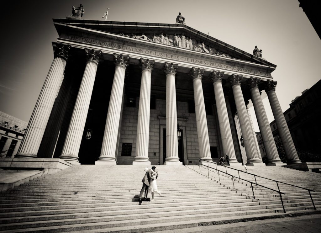 Couple on steps of NY Supreme Court for an article on City Hall wedding portrait locations