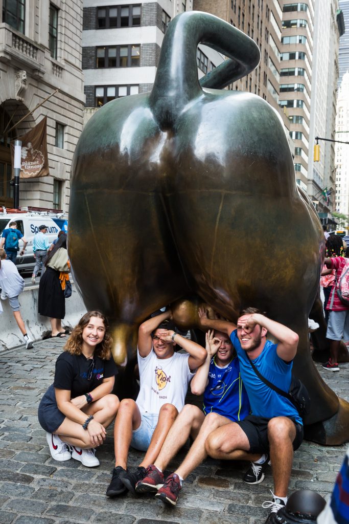 Tourists and Wall Street bull for an article on City Hall wedding portrait locations