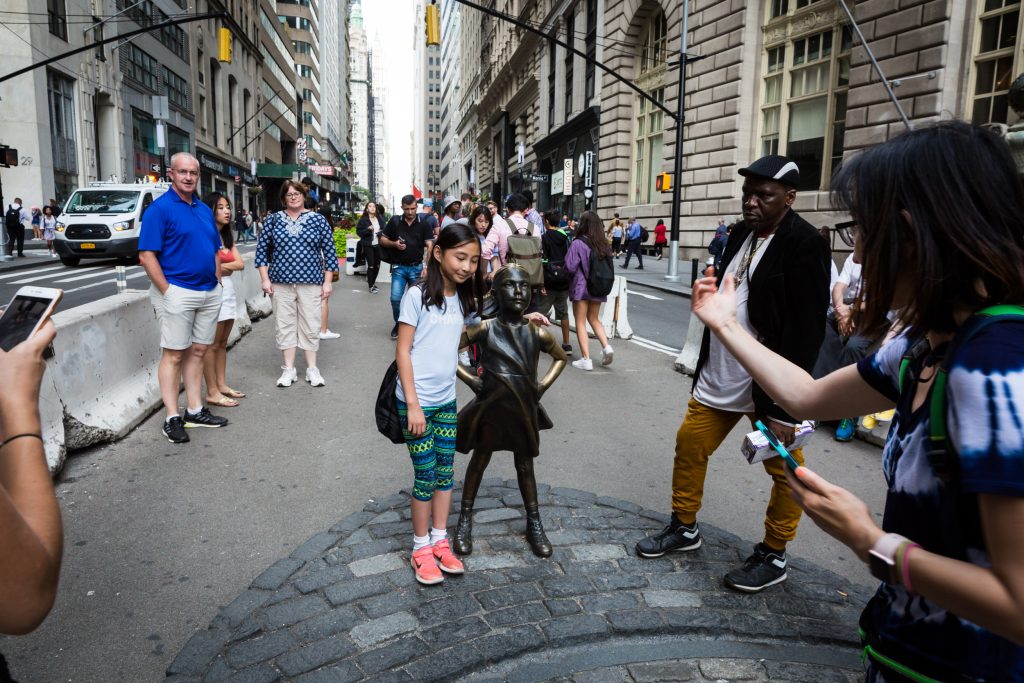 Tourists and little girl statue for an article on City Hall wedding portrait locations