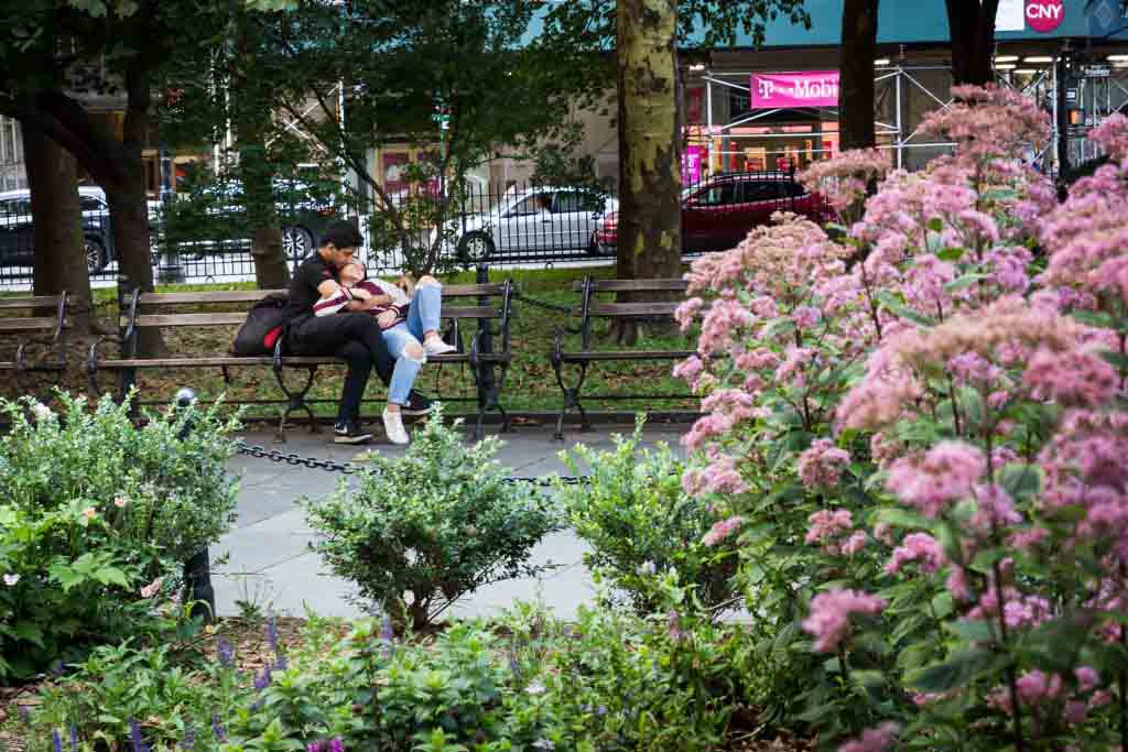 Couple on a bench for an article on City Hall wedding portrait locations