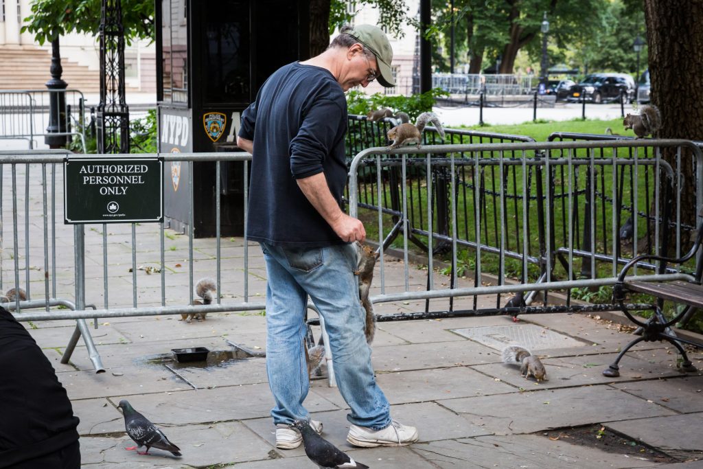 Man with squirrels for an article on City Hall wedding portrait locations