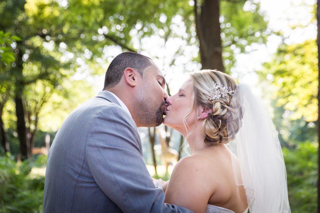 Bride and groom kissing at a Bronx Zoo wedding
