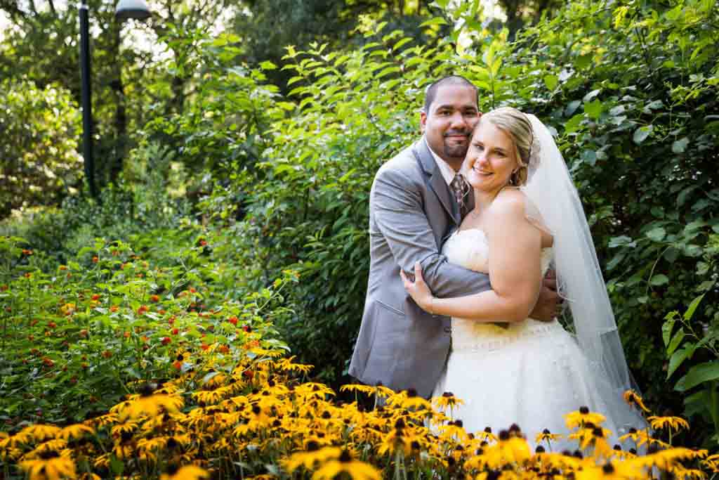 Bride and groom in butterfly garden at a Bronx Zoo wedding