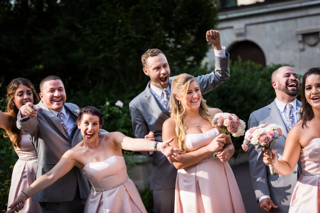 Bridal party cheering at a Bronx Zoo wedding