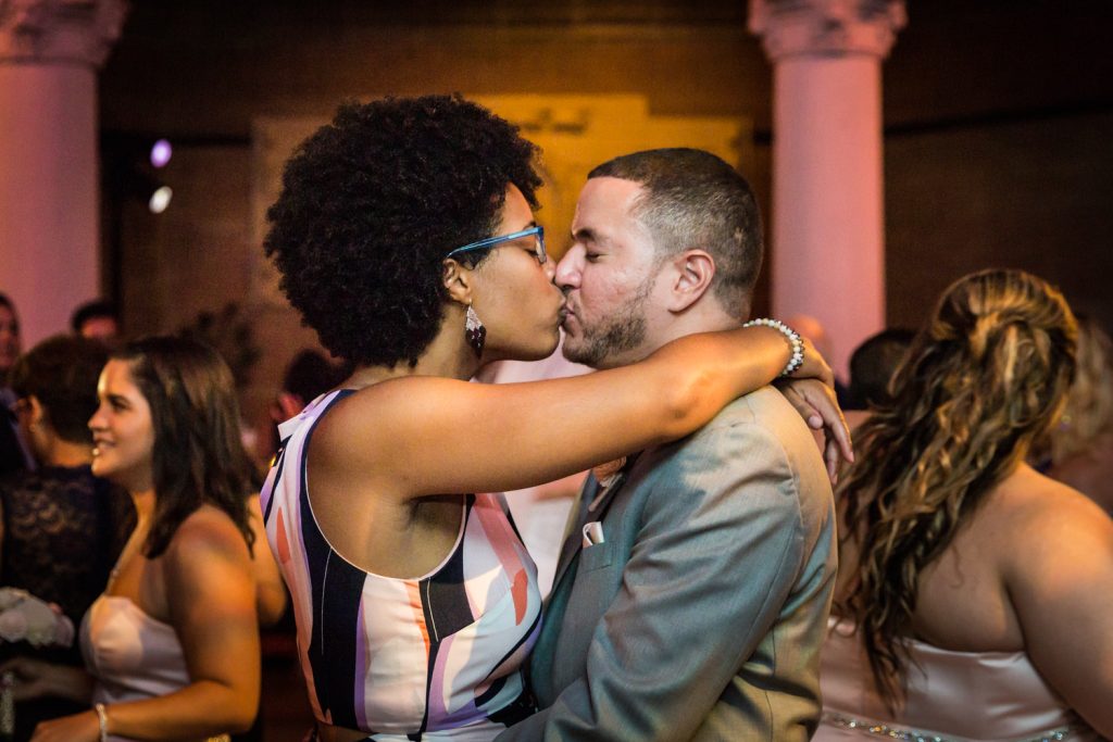 Guests kissing at a Bronx Zoo wedding
