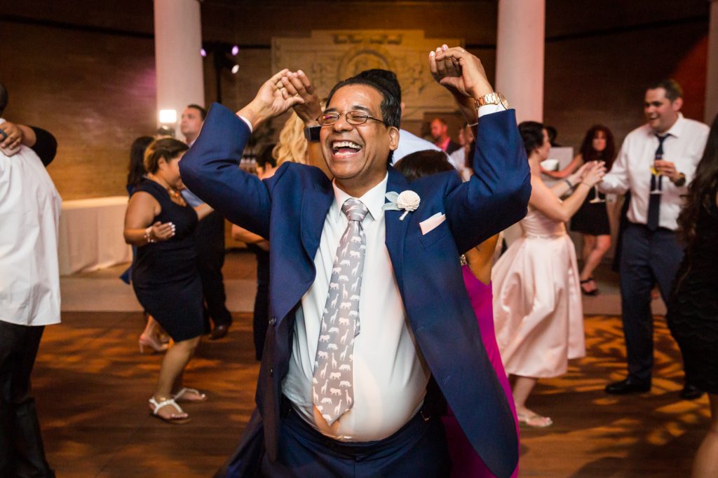 Father of the bride dancing at a Bronx Zoo wedding