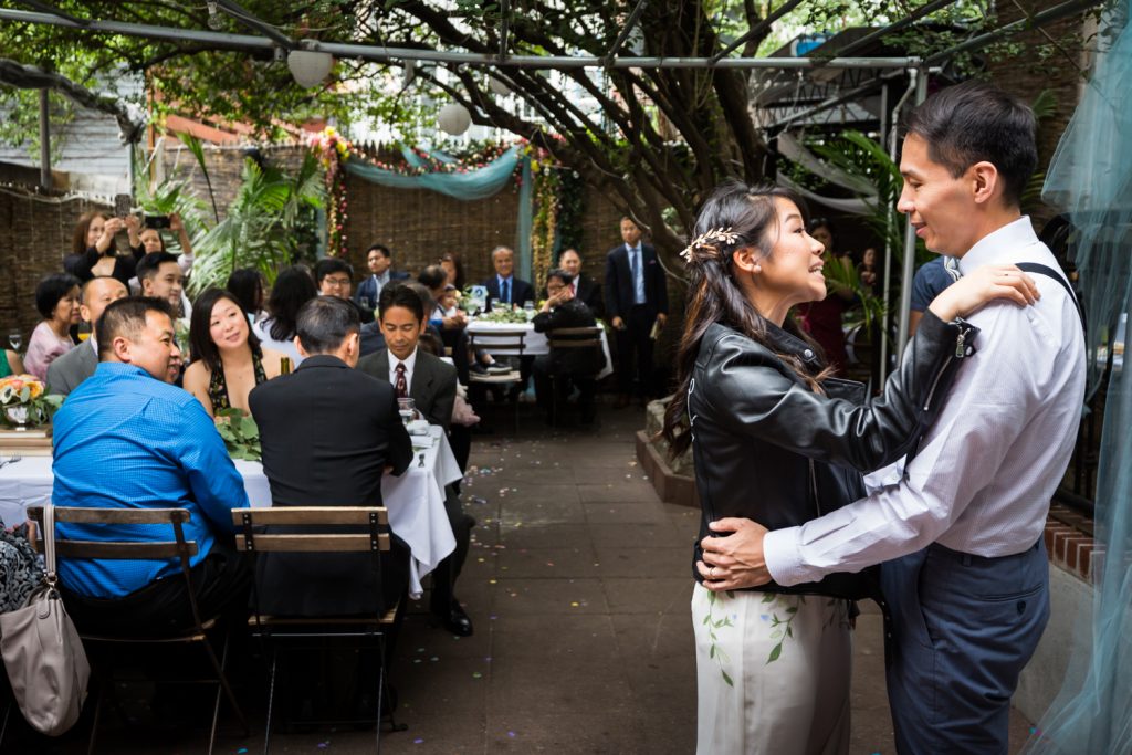 Bride and groom having first dance in restaurant patio