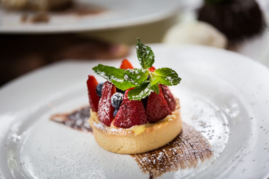 Mixed berry tart for an article on the pros and cons of a restaurant wedding