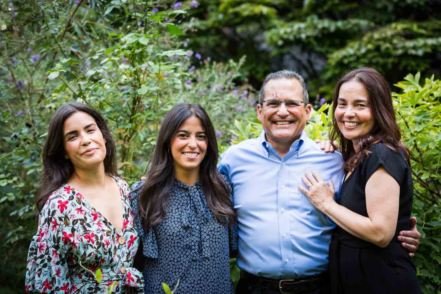 Family in middle of garden at a community garden family portrait session