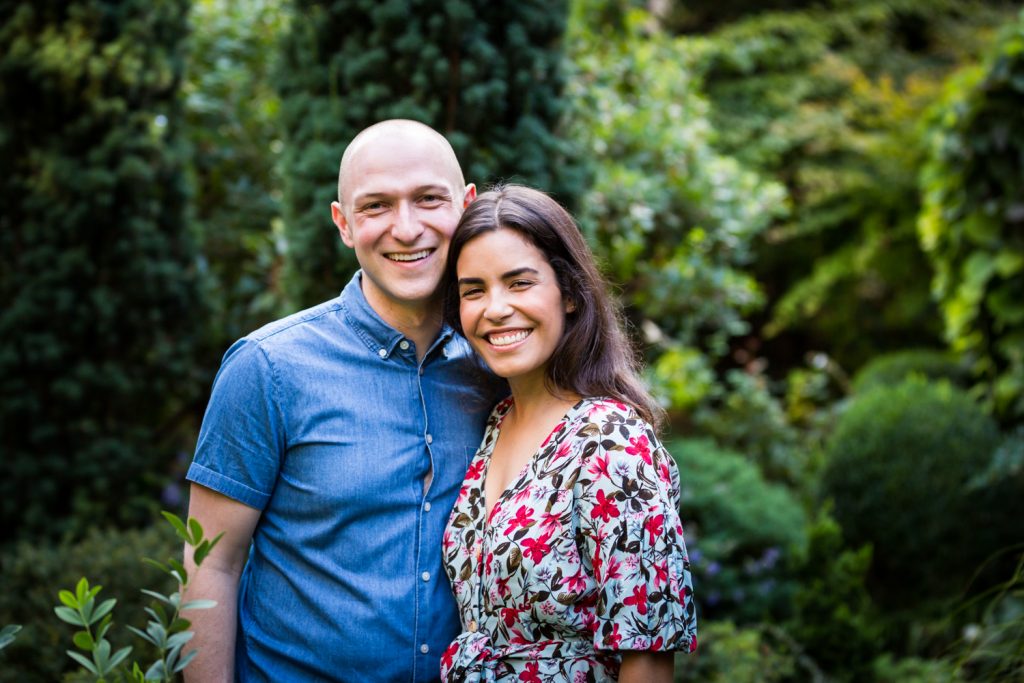 Couple in middle of garden at a community garden family portrait session