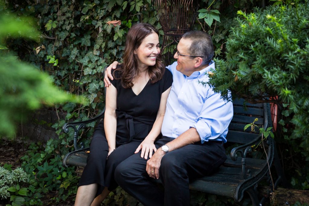 Older couple sitting in middle of garden at a community garden family portrait session