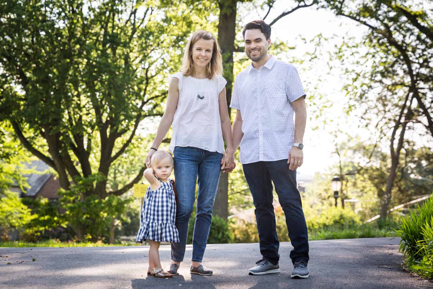 Mother, father, and little girl in Forest Park for an article on toddler portrait tips