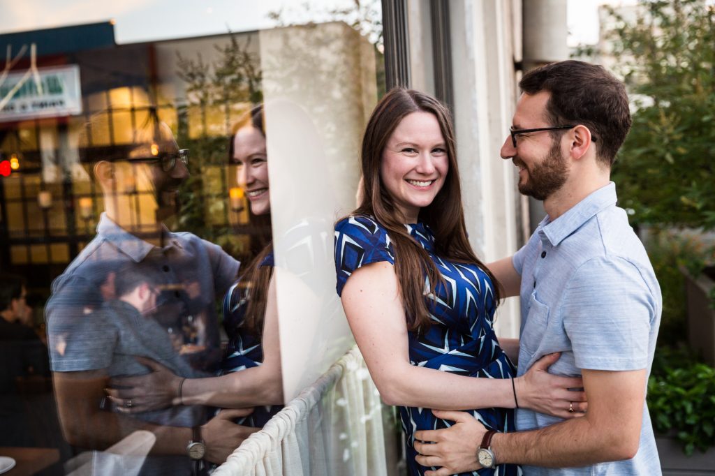 Couple dancing in front of a window before their ketubah signing