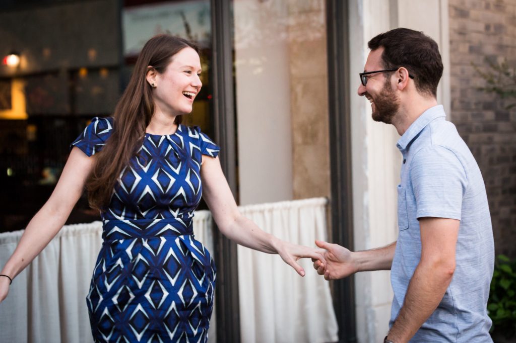 Couple posing for engagement portrait before ketubah signing