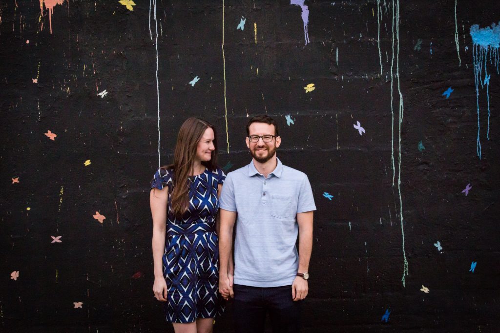 Couple posing for engagement portrait before ketubah signing