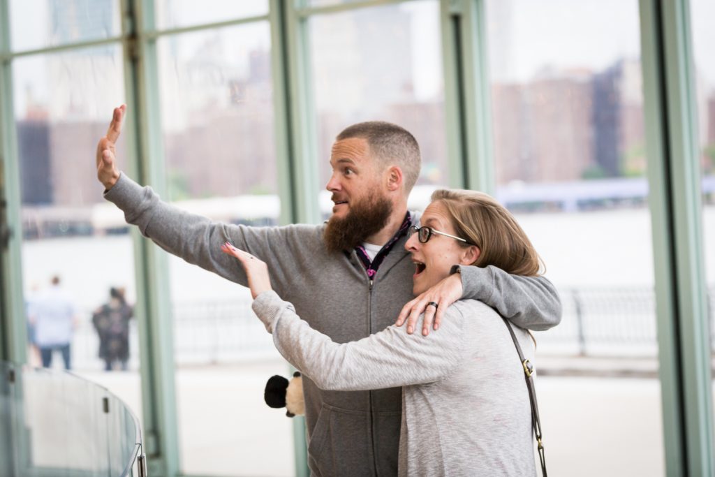 Man and woman waving