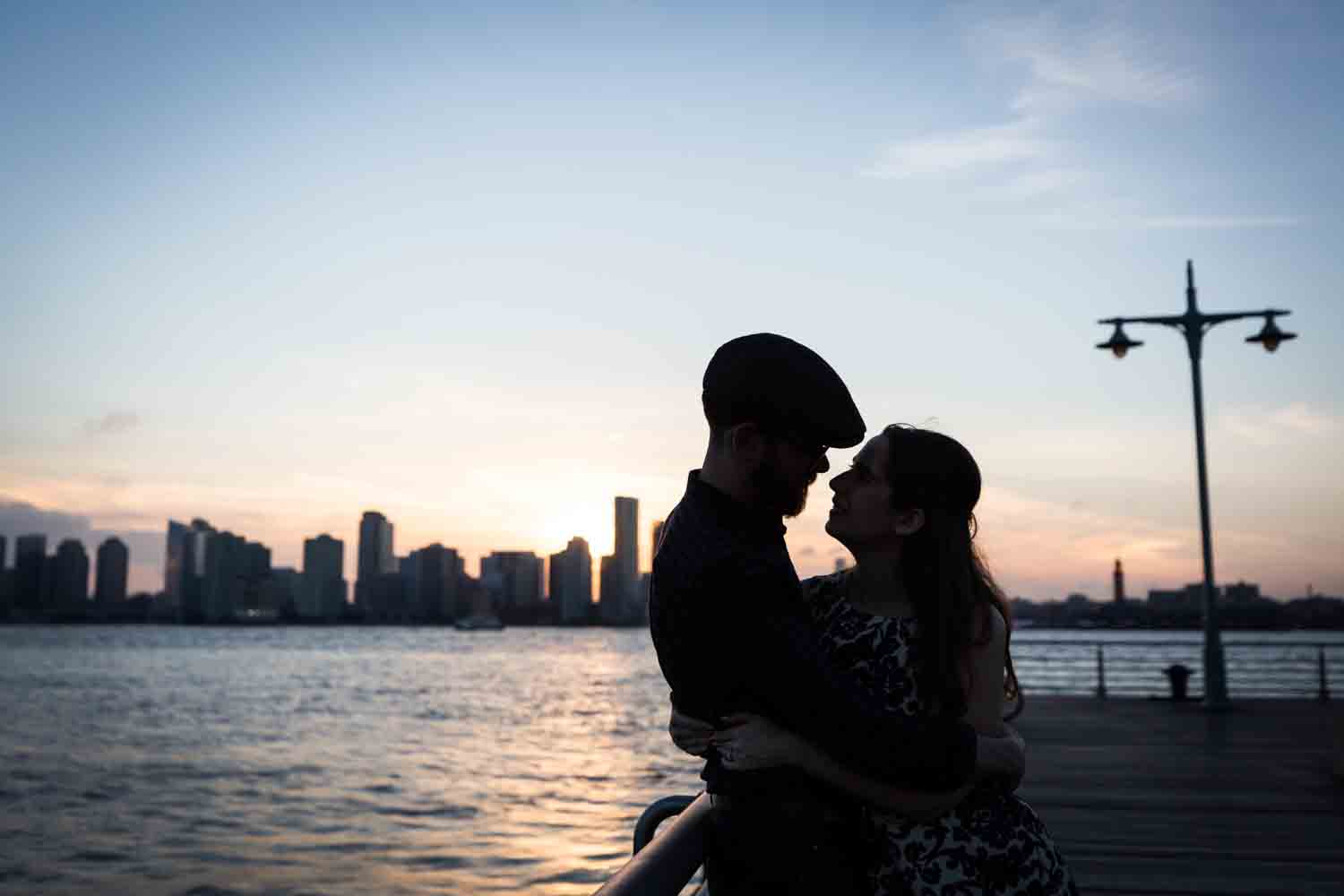Backlit photo of couple in front of Hudson River