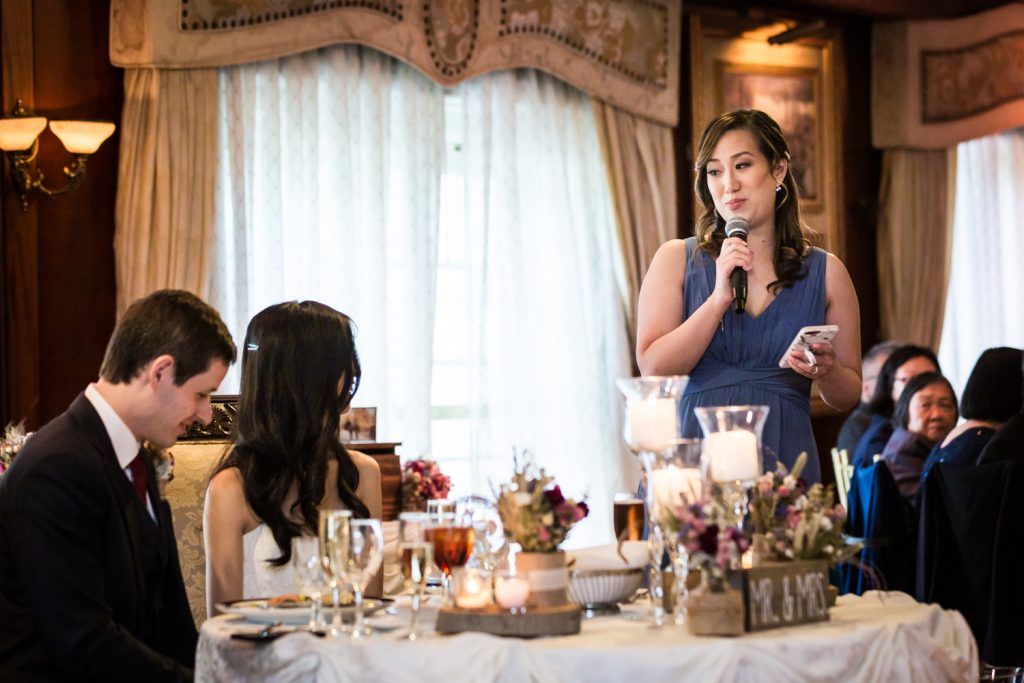 Maid of honor making speech to bride and groom at a Westbury Manor wedding