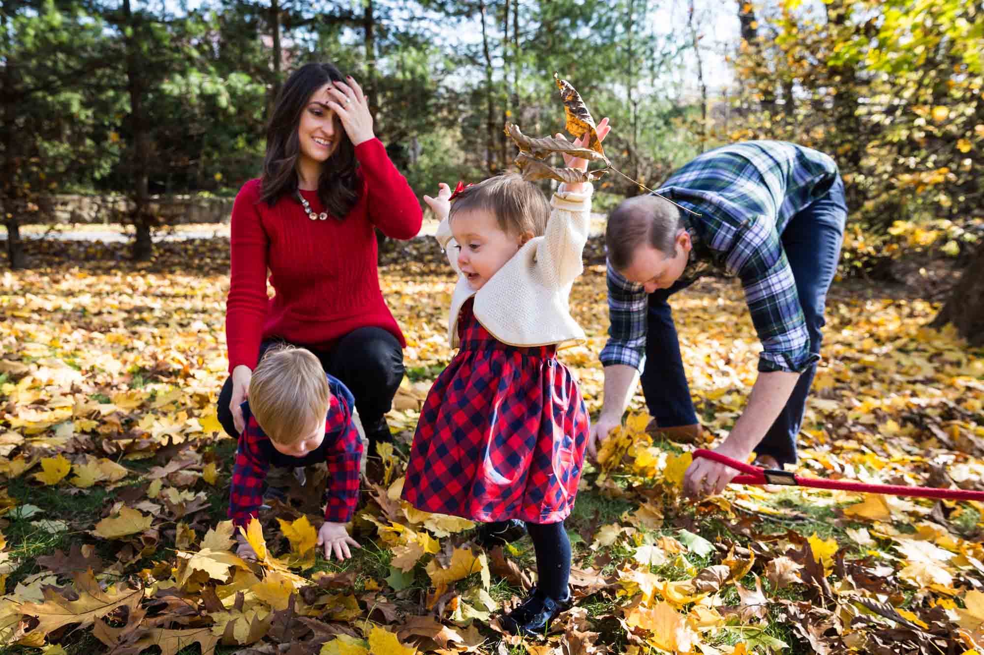 Family in leaves for article on how to get your kids to look into the camera