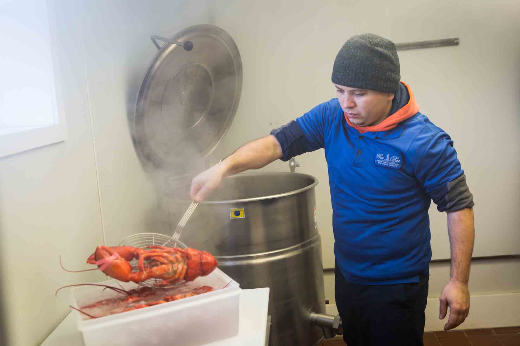 Man with steaming lobster for an article on website photography tips