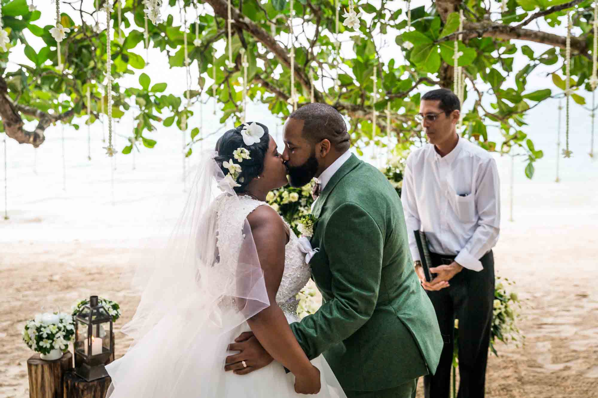 Bride and groom kissing for an article on destination wedding photography tips