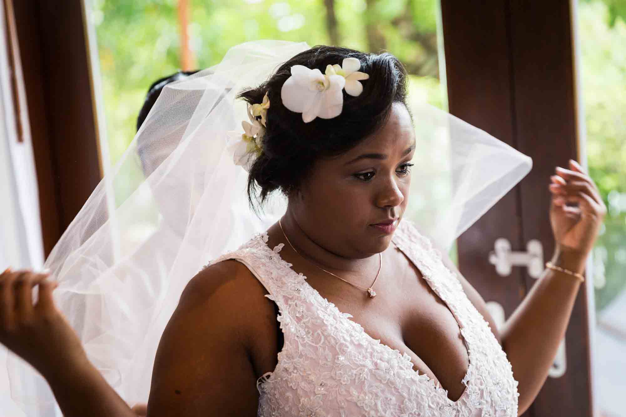 Bride with veil for an article on destination wedding planning tips