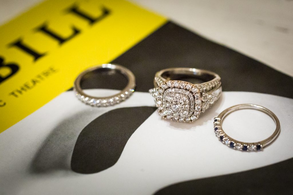 Close up of engagement rings on a Phantom playbill