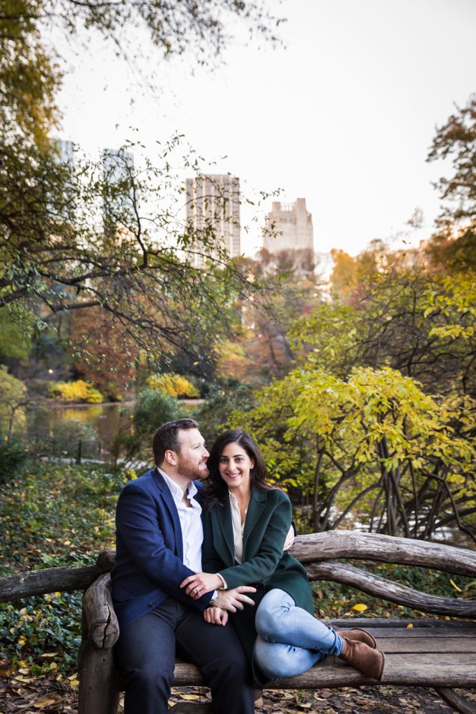Couple sitting on wooden bench in Central Park