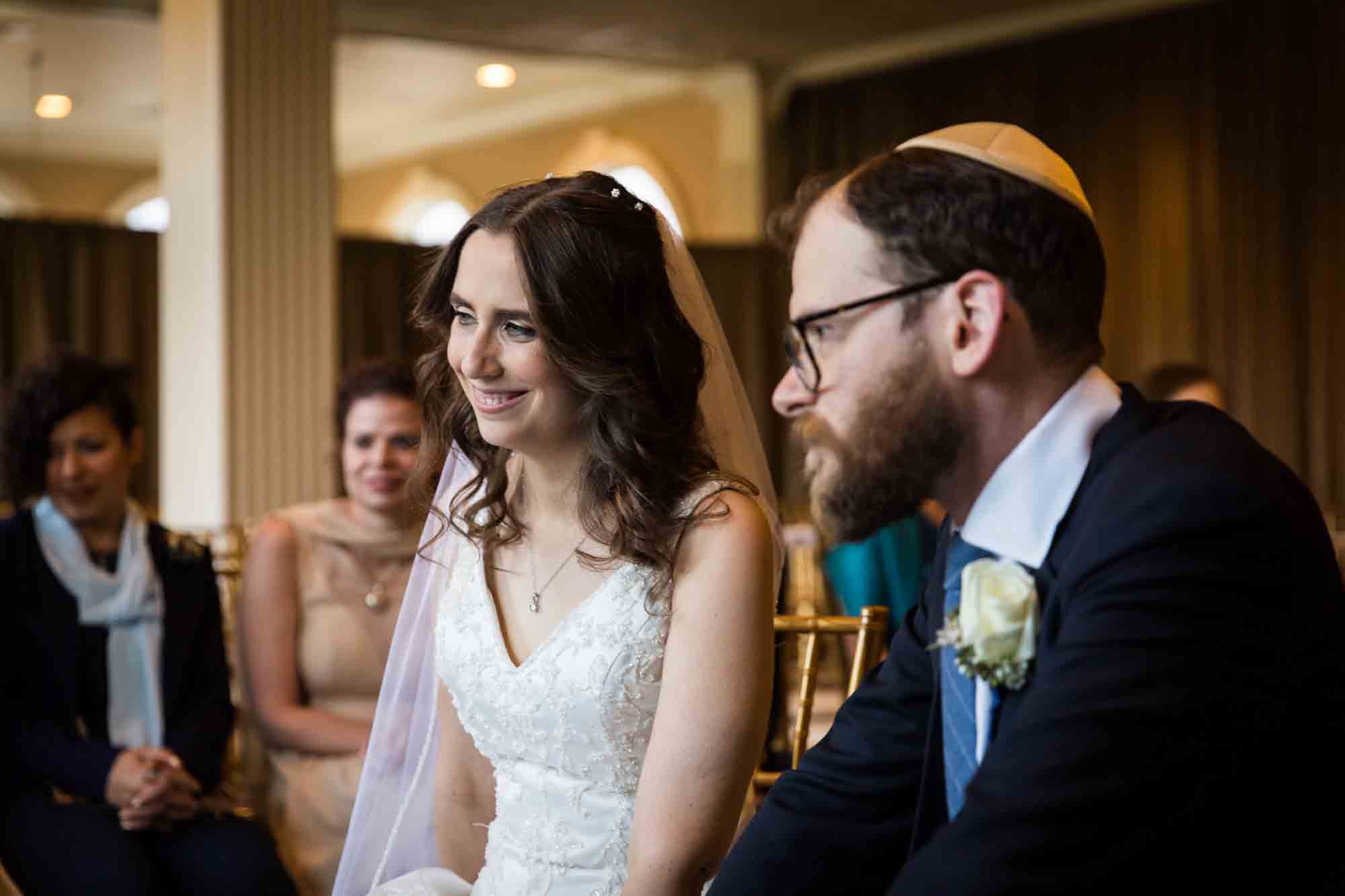 Bride and groom at ketubah signing for an article on band vs DJ