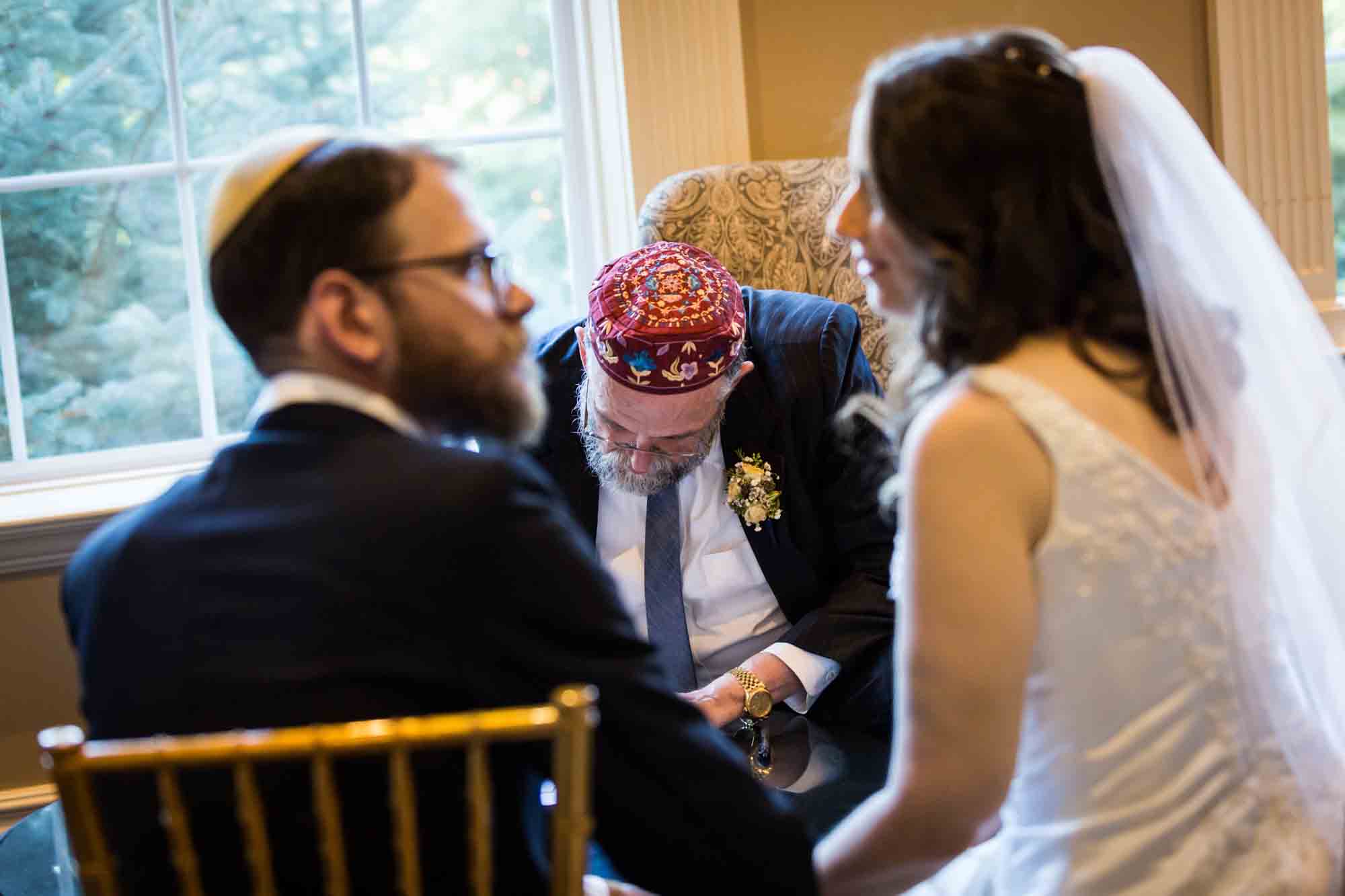 Bride and groom at ketubah signing for an article on band vs DJ