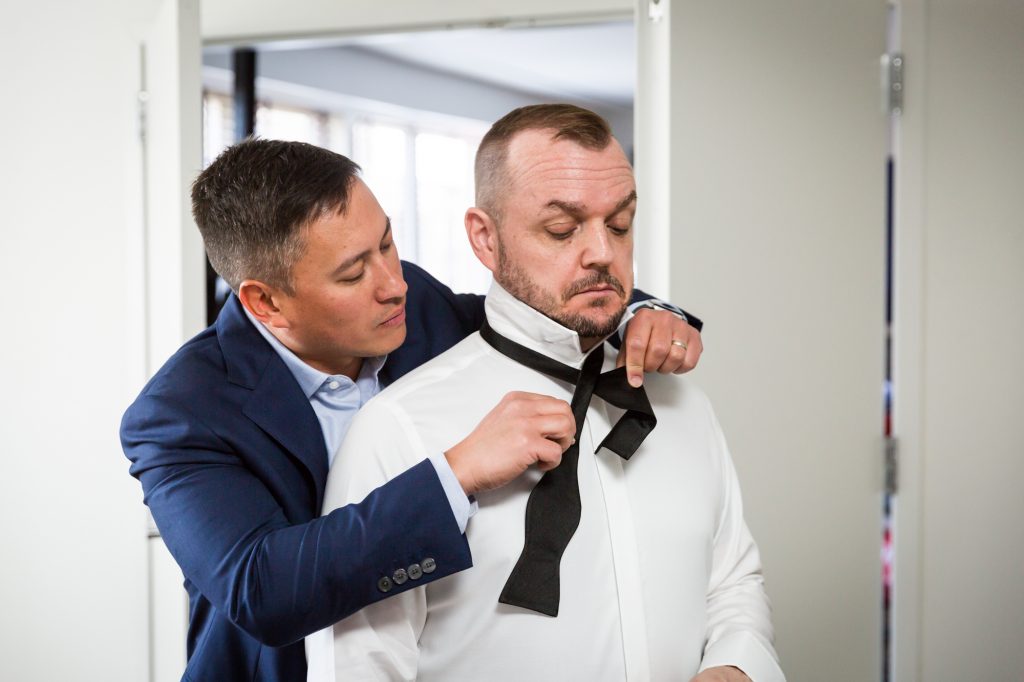 Grooms getting ready at a same sex wedding celebration in Washington DC