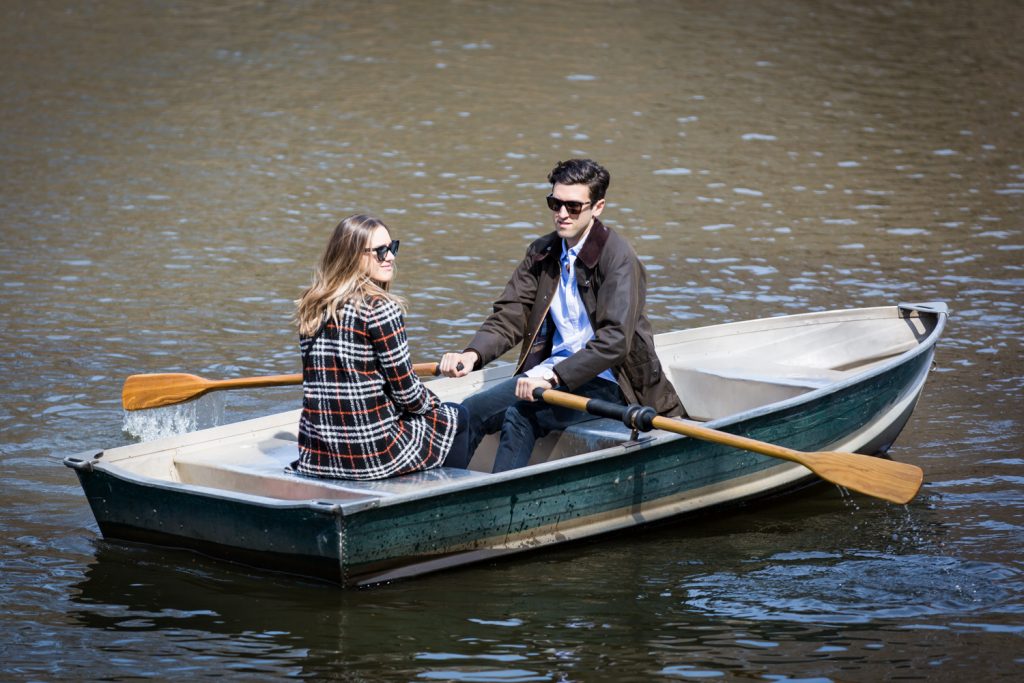 Man and woman wearing sunglasses and rowing a boat for article on Central Park Lake proposal tips