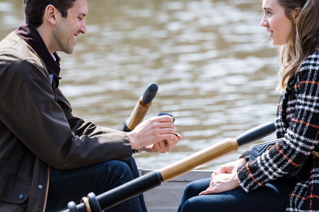 Man in boat asking his girlfriend to marry him for an article on Central Park Lake proposal tips