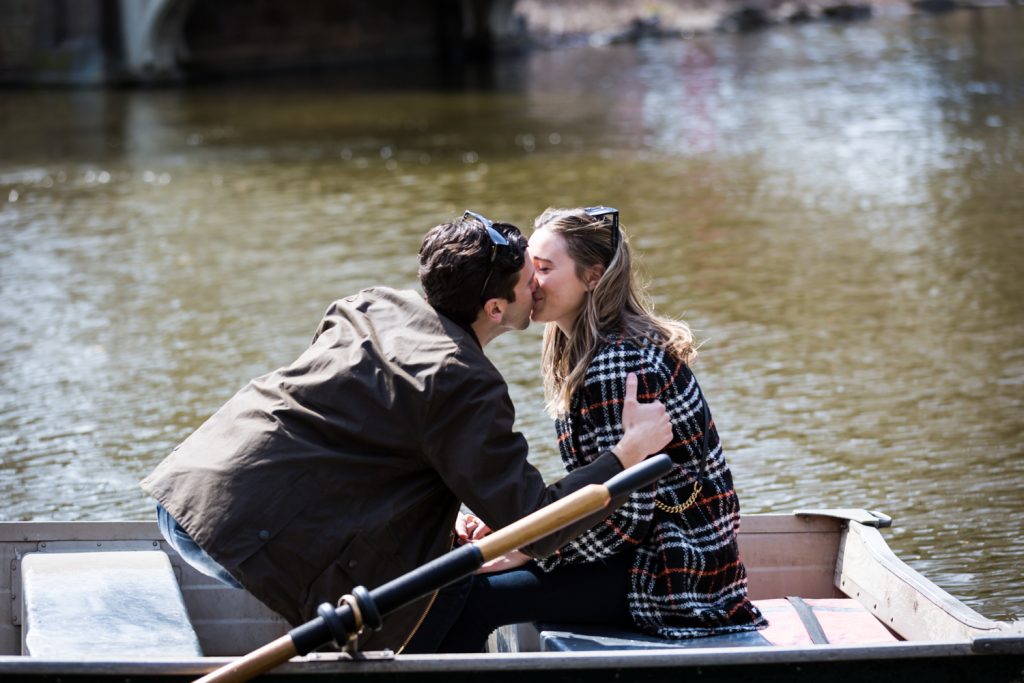 Man and woman kissing in boat on Central Park Lake