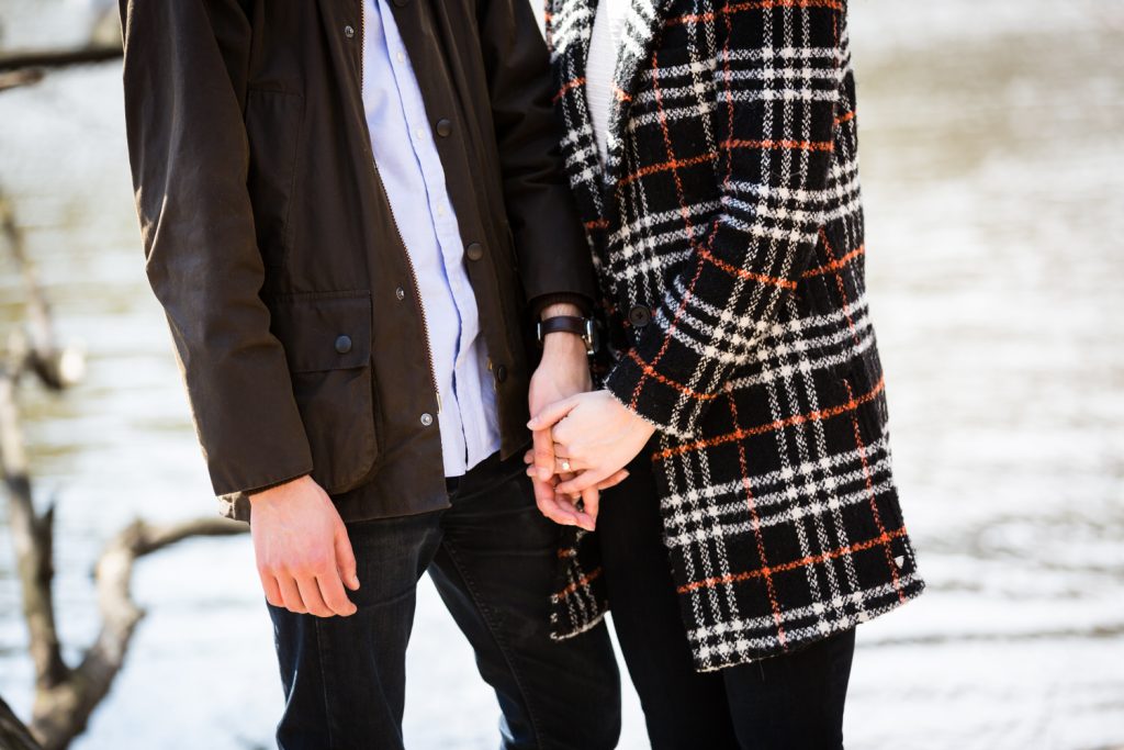 Close up on couple holding hands