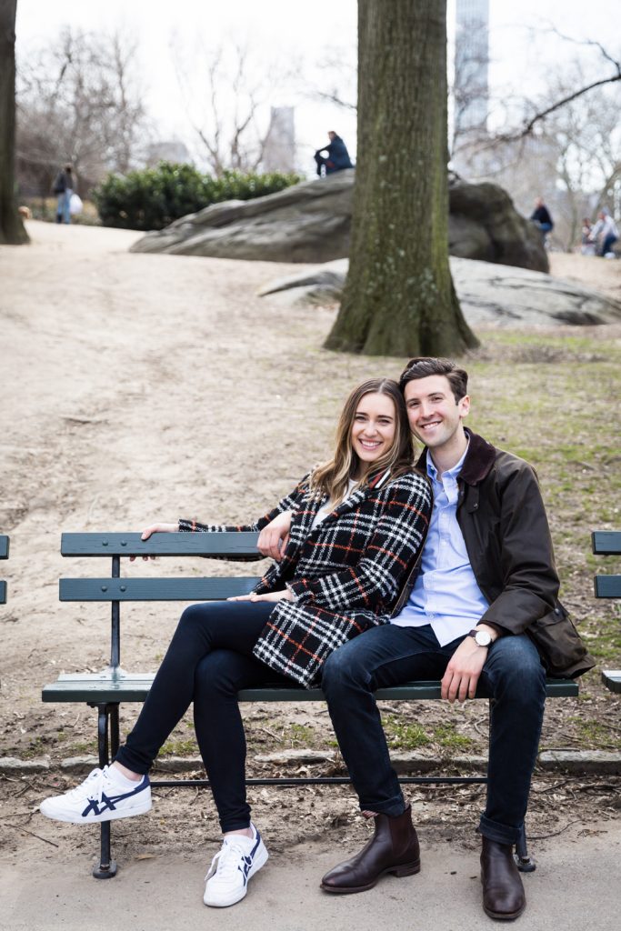 Portrait of man and woman on bench in Central Park for article on Central Park Lake proposal tips