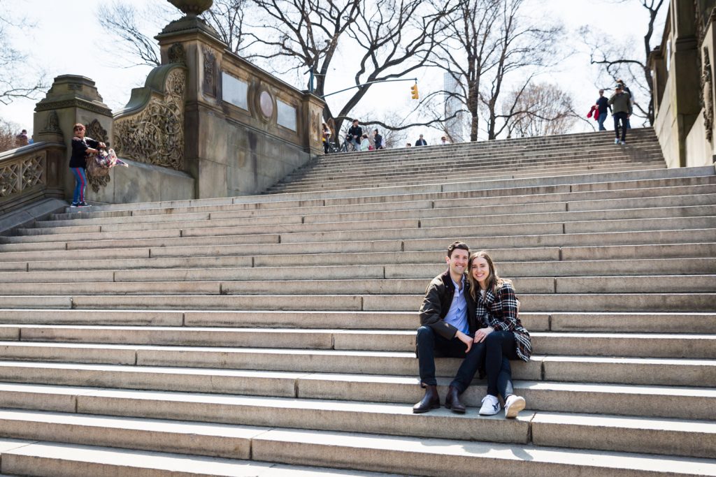 Portrait of couple sitting on steps of Bethesda Fountain