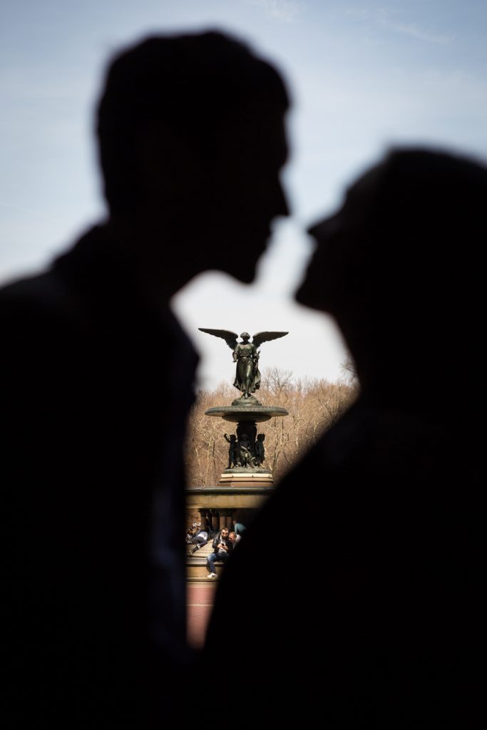 Silhouette of couple with Bethesda Fountain in the background