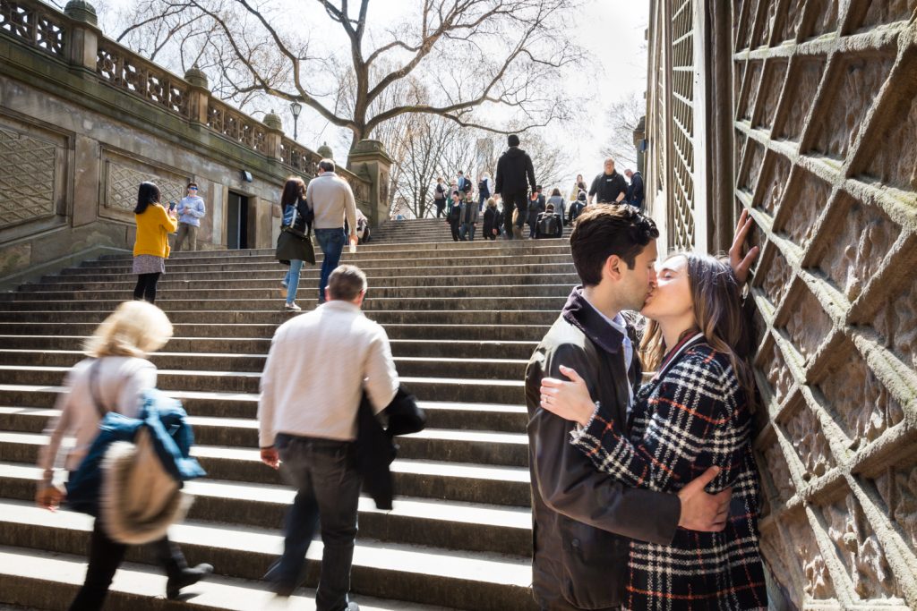 Couple kissing by Bethesda Fountain steps