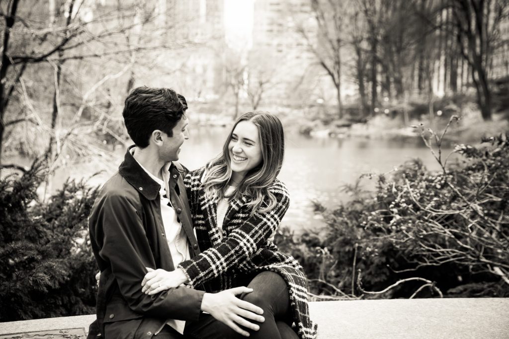 Black and white photo of couple with Central Park Lake in background